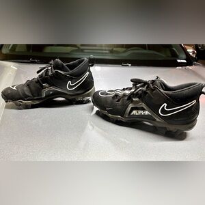 Size 8 Alpha Nike football shoes/cleats in great shape. Black & White.